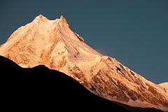 Manaslu 07 03 Manaslu Medium Shot Sunrise From Syala Wow! The subtle changes of the light on Manaslu are terrific. Manaslu (8156m) is said to derive from the Sanskrit word Manasa, which means soul; therefore Manaslu is the Mountain of the Soul. It was earlier known as Kutang I, while the Survey of India�s symbol was merely Peak XXX. According to Snelgrove, the local Tibetan name for Manaslu is Pung-gyen, which is also the name to the god who resides on it.